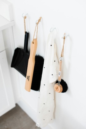 cleaning hack: cleaning brushes hanging on a wall