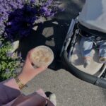 new mother practicing self-care while walking baby in cozy stroller