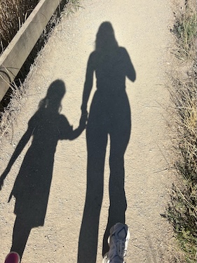 Happy mom implementing solutions to reduce parenting burnout